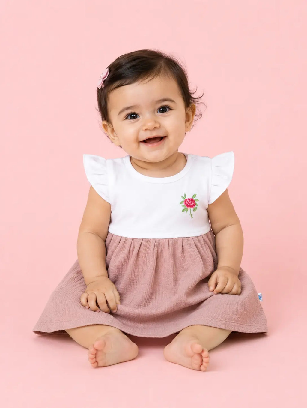 Dusty Pink — Tiny Rose organic cotton baby dress worn by baby model, premium baby clothes India, baby clothes for sensitive skin and sustainable baby clothing India by BabyRo