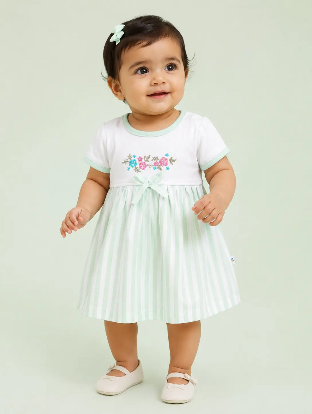 Misty Green — Tiny Meadow organic cotton baby dress worn by baby model, soft cotton baby clothes for sensitive skin, premium baby clothes India and sustainable baby clothing India by BabyRon