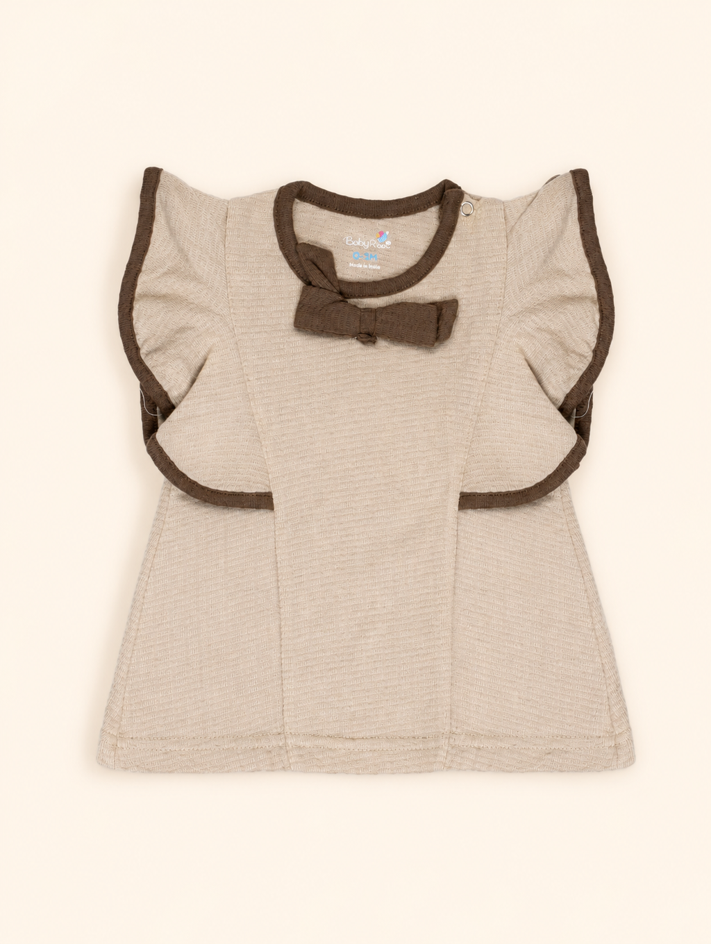 Oatmeal Beige — BabyRon Empress organic cotton baby dress worn by baby model, soft cotton baby clothes for sensitive skin, premium baby clothes India and sustainable baby clothing India by BabyRon