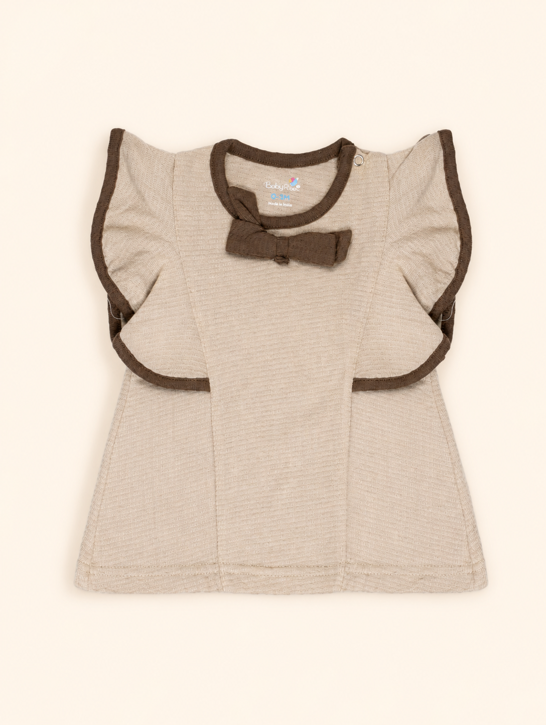 Oatmeal Beige — BabyRon Empress organic cotton baby dress worn by baby model, soft cotton baby clothes for sensitive skin, premium baby clothes India and sustainable baby clothing India by BabyRon