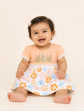 Pretty Peach — Tiny Tulip organic cotton baby dress worn by baby model, premium baby clothes India and baby clothes for sensitive skin by BabyRon