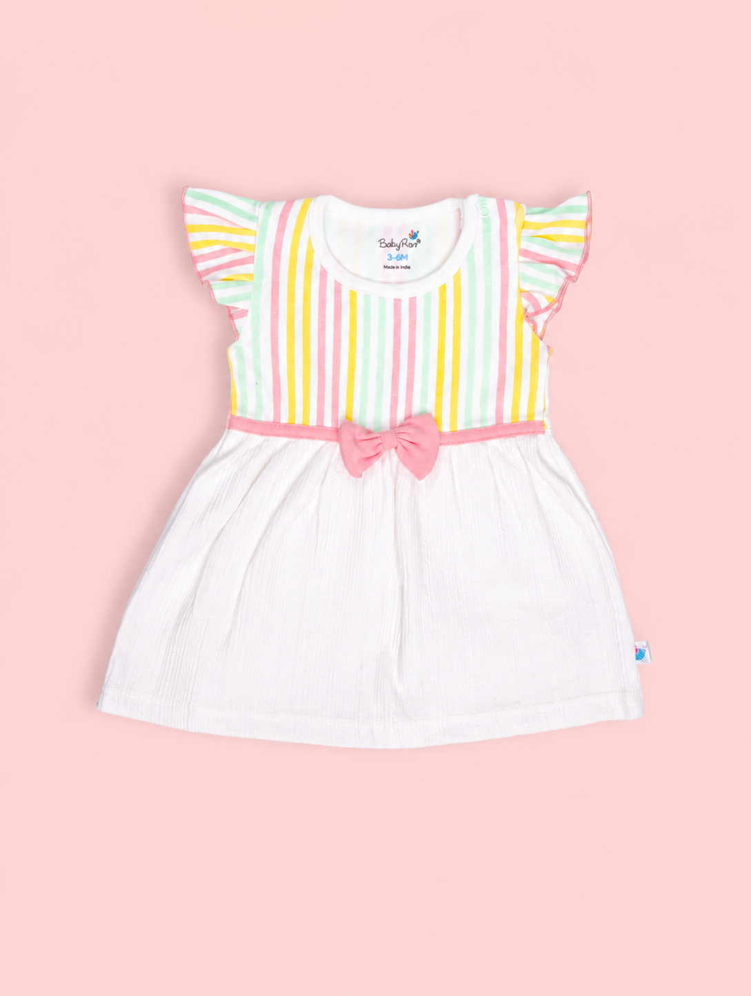 White Rosette — BabyRon Aurora organic cotton baby dress worn by baby model, soft cotton baby clothes for sensitive skin, premium baby clothes India and sustainable baby clothing India by BabyRon